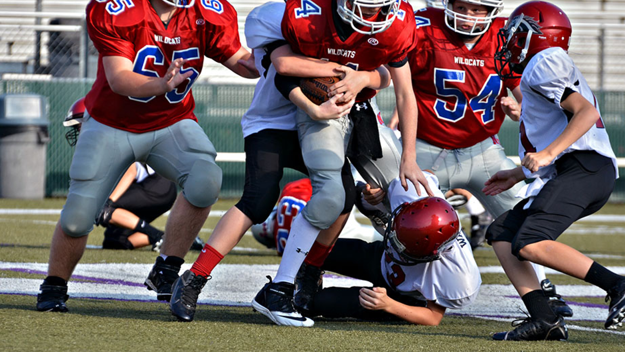 Safe Tackling, Padded Helmets Reduce Head Injuries in Youth Football